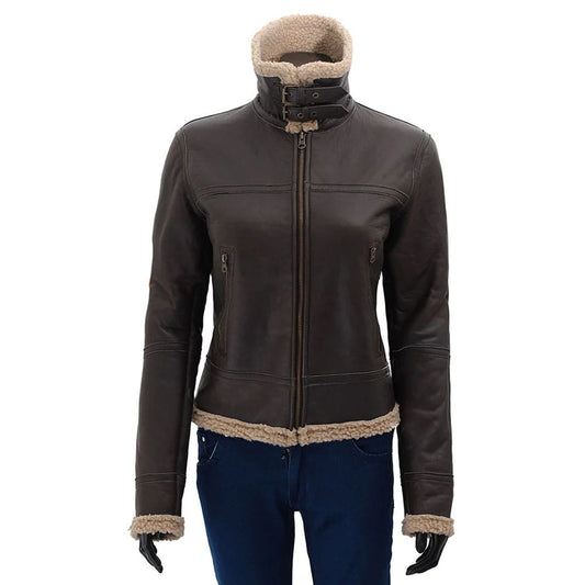 A dark brown faux-leather jacket with a beige sherpa lining, featuring a high collar, front zipper, and zippered side pockets, shown on a mannequin with blue jeans against a white background.