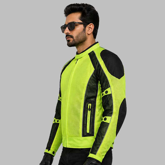 Man wearing a bright green and black motorcycle jacket on a gray background