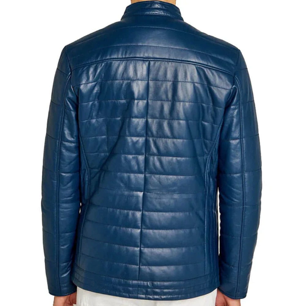 A man wearing a blue quilted leather jacket, shown from the back against a plain white background.