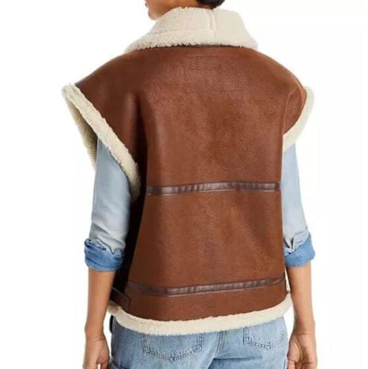 Brown leather vest with white fur lining worn by a person on a white background