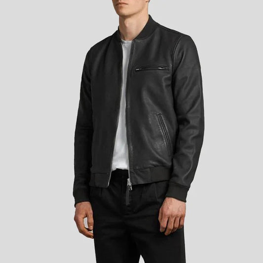 Person wearing a black leather jacket on a light gray background