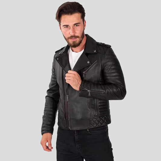 Man wearing a black leather jacket on a gray background