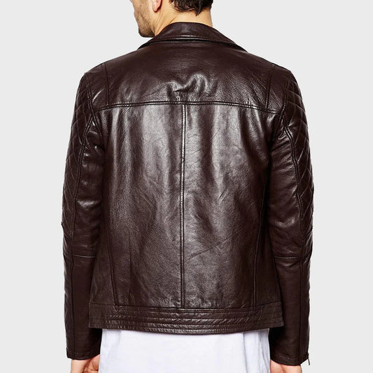 Brown leather jacket worn by a person on a light gray background