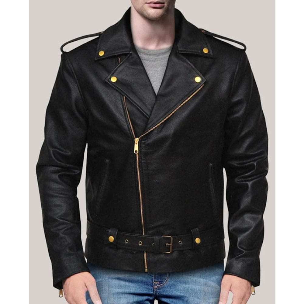 A man wearing a black leather motorcycle jacket with gold-tone hardware, including snap buttons, zipper details, and a matching belt, paired with blue jeans against a solid light gray background.