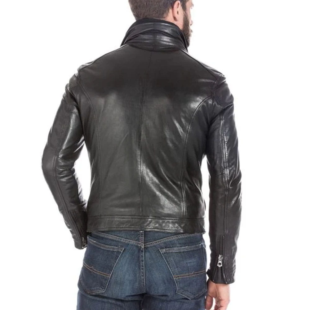 A man viewed from the back wearing a black leather jacket and blue jeans against a plain white background.