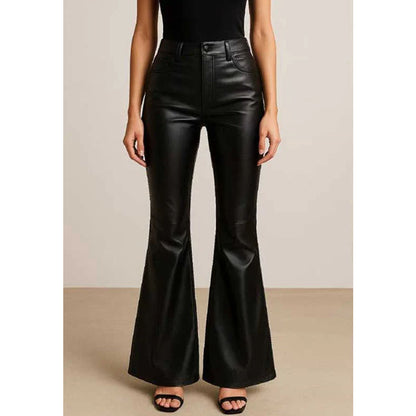 A model wearing black high-waisted faux leather flare pants, paired with a black top and black sandals, standing against a neutral beige studio background.