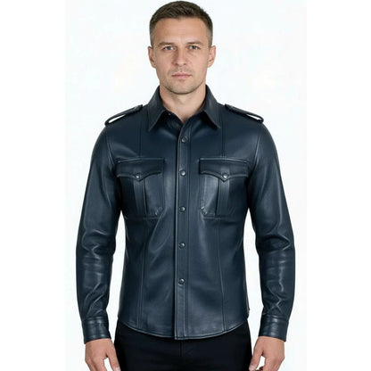 A man wearing a dark navy blue leather military-style shirt jacket with shoulder epaulets and two chest pockets, photographed against a plain white background.