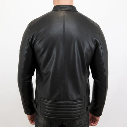A man viewed from the back wearing a black leather jacket, showing the back panel stitching and ribbed waist detail against a plain white background.