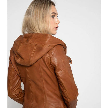 A woman shown from the back wearing a brown faux-leather hooded jacket against a light gray studio background.