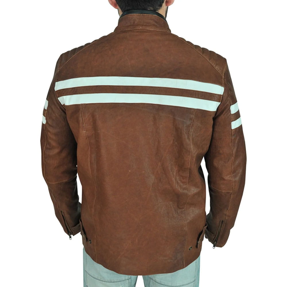 A man viewed from the back wearing a brown leather jacket with two horizontal light blue stripes across the shoulders and upper arms, paired with light blue jeans against a plain white background.