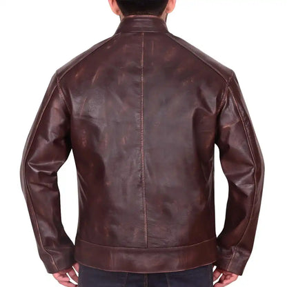 A man viewed from the back wearing a dark brown distressed leather jacket, set against a plain white background.