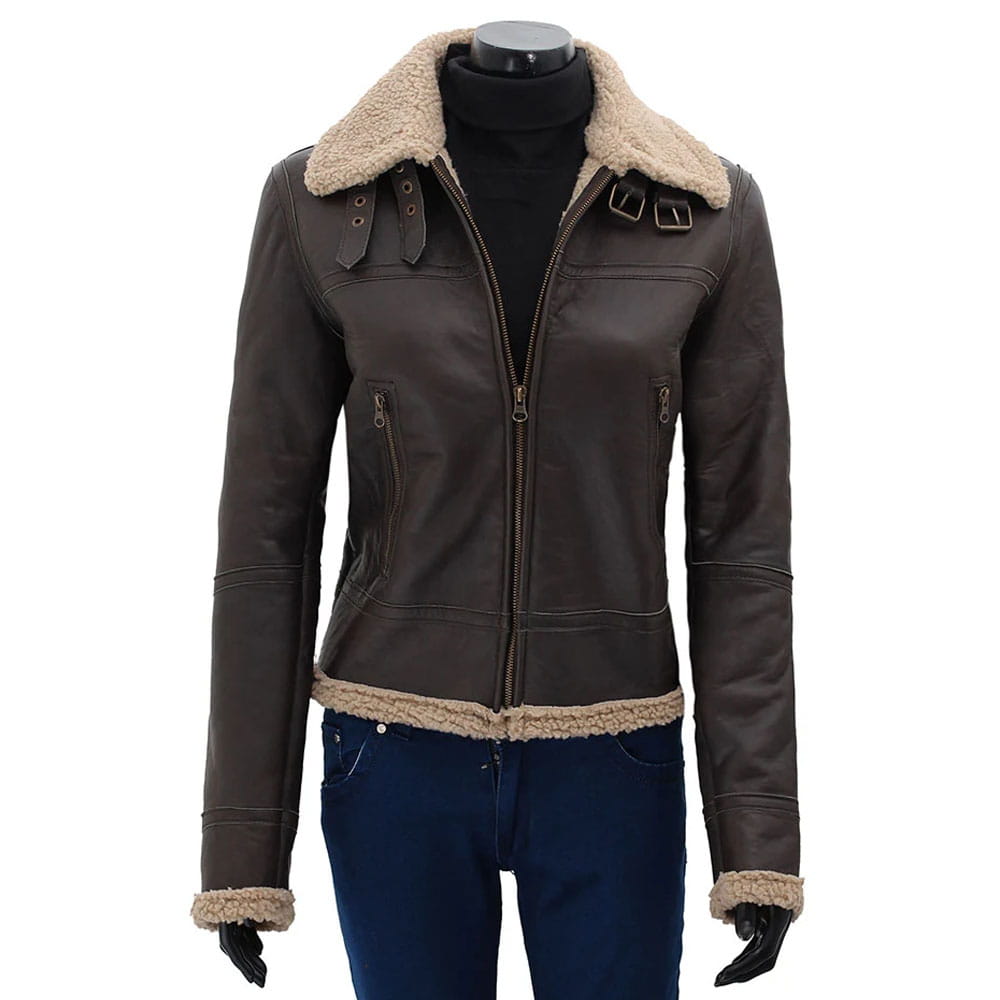 A dark brown leather aviator-style jacket with a beige shearling collar, hem, and cuffs, displayed on a black mannequin torso wearing blue jeans and black gloves against a white background.