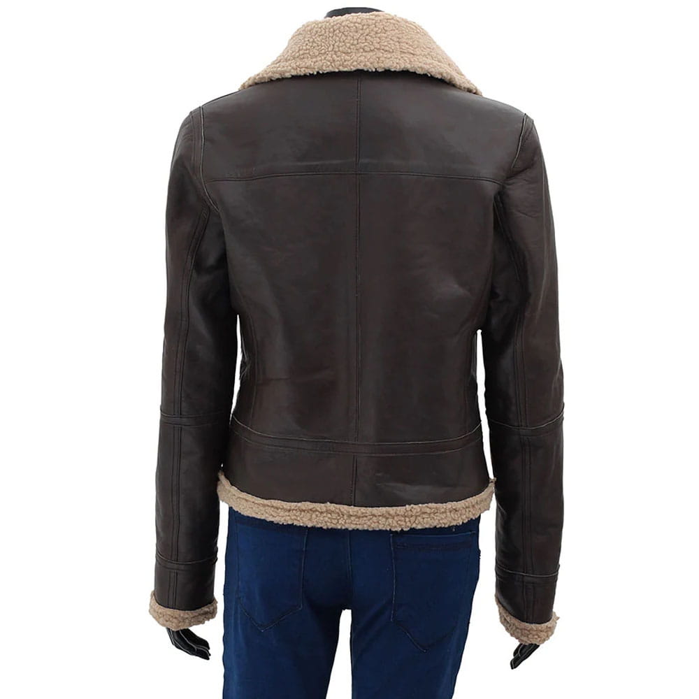 A dark brown leather aviator jacket with a beige sherpa lining, shown from the back on a mannequin wearing blue jeans against a white background.