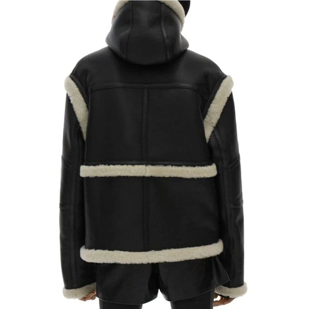 Black faux-leather hooded jacket with cream shearling-style trim, shown from the back on a white background.