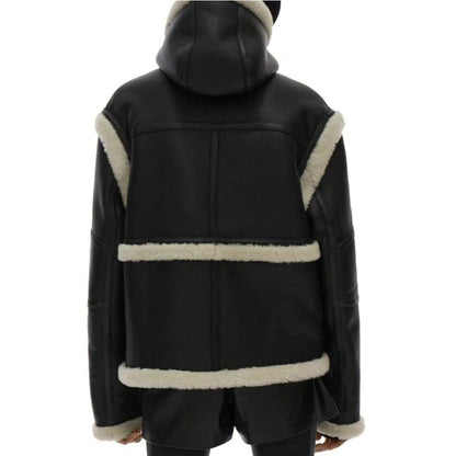 Black faux-leather hooded jacket with cream shearling-style trim, shown from the back on a white background.