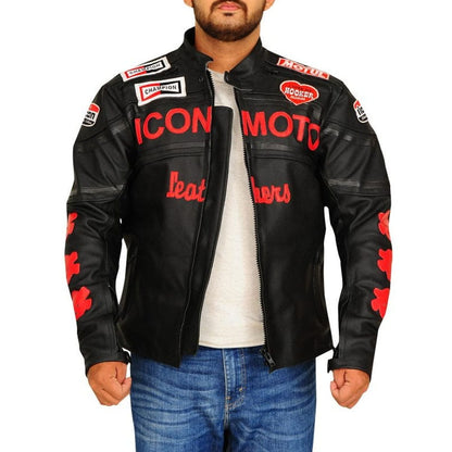 A man wearing a black leather motorcycle jacket with red and white graphics, including 'ICON MOTO' and 'leathers' on the front, paired with a white t-shirt and blue jeans against a white background.