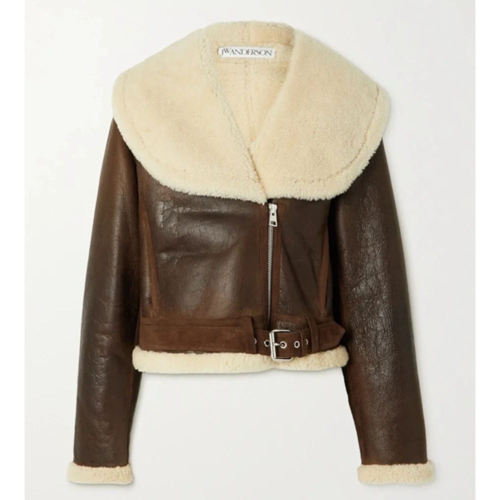 A cropped brown faux-leather aviator jacket with a large cream shearling collar, matching shearling trim at the hem and cuffs, and a front zipper closure.