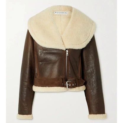 A cropped brown faux-leather aviator jacket with a large cream shearling collar, matching shearling trim at the hem and cuffs, and a front zipper closure.