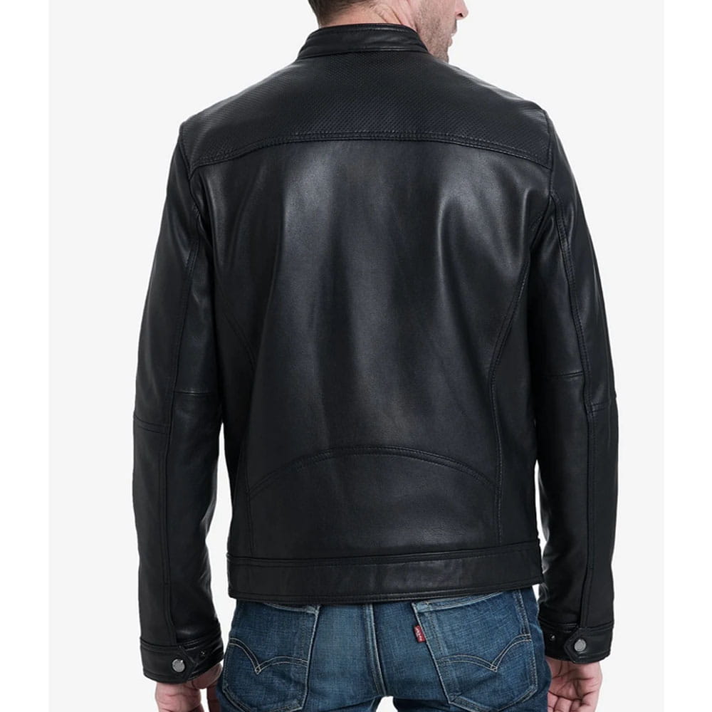 A man wearing a black leather jacket, shown from the back, paired with blue jeans against a plain white background.
