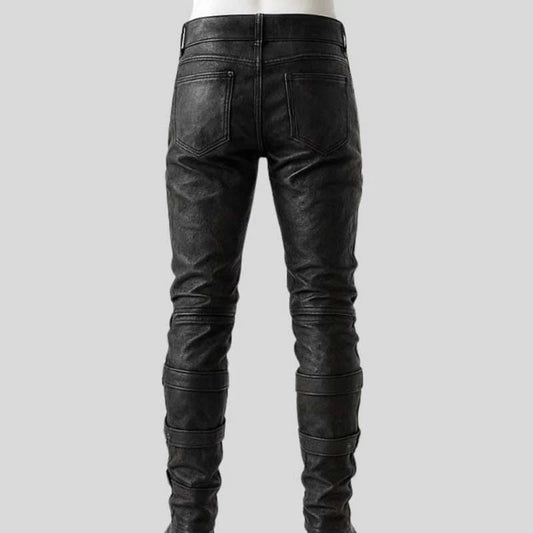 Black leather pants on a gray background