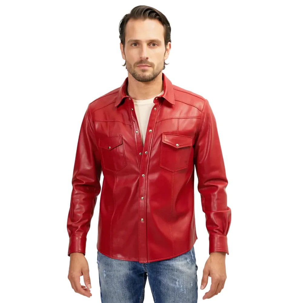 A man wearing a red leather western-style button-up shirt with chest pockets, paired with blue jeans, against a plain white background.