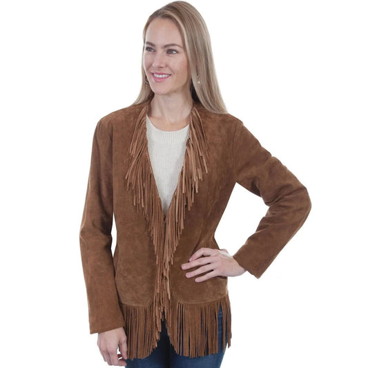 A woman modeling a brown suede fringe jacket over a cream knit top and blue jeans, photographed against a plain white studio background.