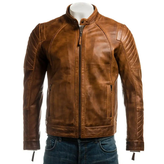 A brown leather motorcycle jacket displayed on a mannequin torso with blue jeans against a plain white background.