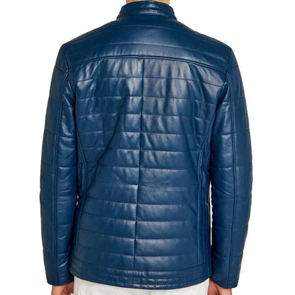 A man wearing a blue quilted leather jacket, shown from the back against a plain white background.