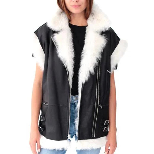 Black vest with white fur trim worn by a person on a white background