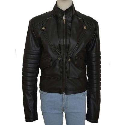 A black faux leather motorcycle jacket with a stand collar, diagonal chest pockets, and ribbed sleeves, displayed on a mannequin torso wearing light blue jeans against a white background.