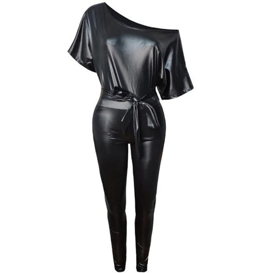 A shiny black one-shoulder jumpsuit with a tie waist, displayed on a headless mannequin against a plain white background.