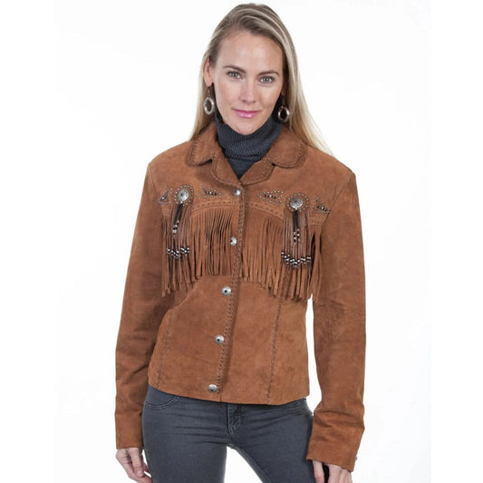 A woman modeling a brown suede western-style jacket with fringe and silver-tone decorative embellishments, paired with dark gray jeans against a plain white background.