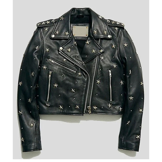 Black leather moto jacket embellished with silver star-shaped studs, displayed flat against a light gray background.
