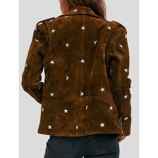 A woman viewed from the back wearing a brown suede jacket with white embroidered stars, paired with dark jeans, against a light gray background.