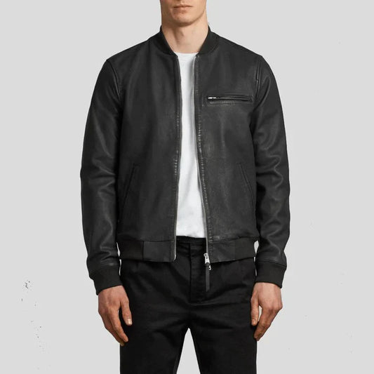 Person wearing a black leather jacket on a light gray background