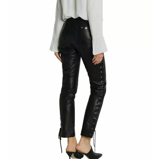 Black faux leather cropped pants with side lace-up detailing and ankle drawstrings, shown on a model from the back wearing a white blouse and black mule heels against a white background.