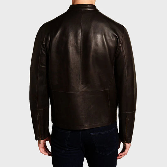 Brown leather jacket worn by a person on a light gray background