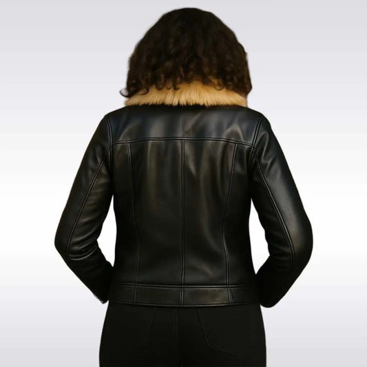 A person viewed from the back wearing a black leather jacket with a tan faux-fur collar, set against a light gray gradient background.